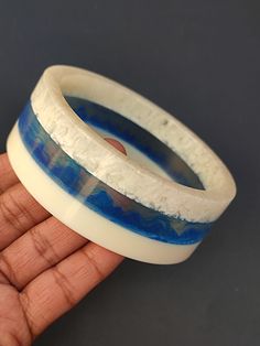 you will receive 1 piece of Resin Jewelry Trends Blue Color Bangle wide Bracelet Resin Art Purely Handcrafted Exclusive Stacking Bohemian Unique Vintage Style Jewelry Inner diameter: 2.6" Approx.  Thank you very much for visiting! Any questions, please feel free to contact us. Discount for bulk provide. Blue Handmade Wearable Art Bracelets, Unique Handmade Blue Bangle, Blue Handmade Wearable Art Bracelet, Artisan Blue Bracelets For The Beach, Blue Resin Bracelets As Gifts, Blue Resin Bracelets For Gifts, Blue Resin Bracelets For Gift, Artisan Blue Bracelet As Gift, Artisan Blue Bangle Cuff Bracelet