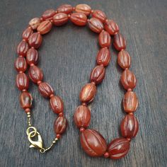 RARE Old antique Indo Tibetan Carnelian Agate Beads Melon Shape Beads necklace agate bead, dark brown Red color. This type of bead can be found in the Himalayan regions. Rare Melon shape.   Antique, with few nicks and very fine usage patina, it presents signs of age We try our best to describe items as detail as we can.and make photos as detail as we can. If you have any doubt about the detail, please contact Us. We promise the things you will receive are 100% same with the photos. Vintage Carnelian Polished Beads Jewelry, Vintage Carnelian Beaded Jewelry, Traditional Carnelian Necklace With Polished Beads, Vintage Agate Beaded Necklace With Large Beads, Vintage Brown Agate Beaded Necklace, Vintage Agate Beaded Necklaces With Large Beads, Vintage Agate Necklaces With Polished Beads, Vintage Brown Agate Beaded Necklaces, Vintage Amber Agate Necklaces