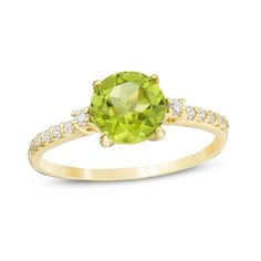 A colorful way to show your love, this gemstone and diamond engagement ring is the start of something beautiful. Crafted in warm 10K gold, this adventurous style features a 7.0mm spring-green peridot flanked by a pair of sparkling diamonds. Dainty diamonds line the shank for the perfect touch of shimmer. Radiant with 1/8 ct. t.w. of diamonds and a brilliant buffed luster, this engagement ring is a unique choice to celebrate your romance. Peridot Engagement Rings, Sapphire Wedding Rings, Peridot Jewelry, Engagement Ideas, Peridot Stone, Natural Diamond Engagement Ring, Green Peridot, August Birth Stone, Spring Green