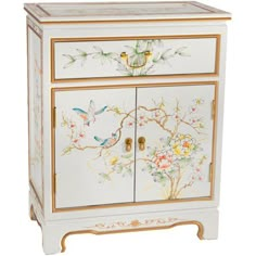 a white and gold decorated cabinet with birds on it's doors, flowers and leaves painted on the front