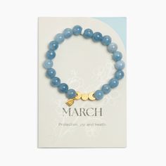 Details Freshly Picked Birthstone Bracelets help you remember the month you fell in love with your baby! Wear this bracelet as a bond between your soul and theirs. The March Birthstone Bracelet features aquamarine semi-precious stone beads to symbolize protection, joy, and health. Made with easy-to-wear elastic, each bracelet includes three gold moon phase charms to represent the women who came before you, the woman you are today, and the mom you hope to be. Get yours today! Features 8mm semi-pr Birthstone Beaded Bracelets, March Birthstone Bracelet, Moon Beads, Jewelry Packaging Design, Semi Precious Stone Bracelet, Harry Potter Baby, New Bracelet, Beaded Necklace Diy, Birthstone Bracelet