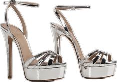 Silver Heels With Heel Strap In Patent Leather, Silver Patent Leather Heels With Heel Strap, Glamorous Patent Leather Sandals For Party, Chic Metallic Silver Heels With Heel Strap, Chic Metallic Patent Leather Sandals, Luxury Metallic Sandals With Heel Strap, Luxury Silver Ankle Strap Sandals, Luxury Metallic Sandals With 4-inch Heel, Silver Luxury Sandals With Heel Strap