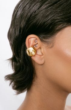 Stack on the shine with this bold ear cuff plated in polished silver or glossy 18-karat yellow gold. Sold as a single earring 5/8"W x 5/8"L 18k-gold plate or rhodium plate Imported Ear Cuff Ideas, Gold Ear Cuff, Back Necklace, Modern Shoes, Ear Stack, Shoes For Leggings, Ear Cuffs, Chain Anklet, Single Earring