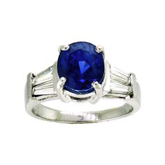 The sapphire in this vintage-style platinum mounting is the most incredible blue. The mixed cut oval is a strongly saturated, violetish blue with a medium dark tone, and moderately included clarity. It's easy to get lost in the deep blue sparkle set off by two tapered baguette diamonds on each side. The platinum mounting is a very sturdy, yet still elegant rendition of the 1940s style. It will stack beautifully with a curved baguette band, or be just as lovely on its own. It's also a nice choice Classic Oval Sapphire Ring With Polished Finish, Classic Blue Sapphire Ring With Oval Cabochon, Luxury Oval Sapphire Ring With Polished Finish, Classic Baguette Cut Sapphire Ring With Polished Finish, Timeless Blue Oval Sapphire Ring, Classic Blue Sapphire Ring With Baguette Cut, Luxury Oval Lab-created Sapphire Ring, Classic Polished Lab-created Sapphire Ring, Baguette Band