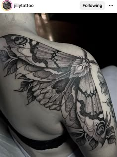 the back of a woman's shoulder with an intricate butterfly tattoo on her left arm