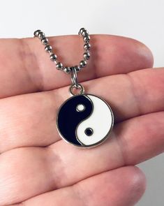 "Yin & Yang necklace, Yin and Yang necklace, unisex black and white with silver charm, on a ball chain necklace which is STAINLESS STEEL. Boho chic bohemian. Occult esoteric jewelry 💕 Yin & Yang is a concept of dualism with its roots in Taoism/ philosophy. The Yin or dark side is associated with shadows, femininity & the trough of a wave, the Yang or light side represents brightness, passion & growth, both sides present duality, both sides work together. *this is a super cute ne Symbolic Black Necklace With Adjustable Chain, Symbolic Black Jewelry With Adjustable Chain, Black Symbolic Jewelry With Adjustable Chain, Symbolic Black Stainless Steel Necklace, Trendy Black Nickel-free Necklace, Hypoallergenic Black Stainless Steel Necklace, Adjustable Hypoallergenic Black Necklace, Black Clavicle Chain Charm Necklace, Black Adjustable Spiritual Charm Necklace