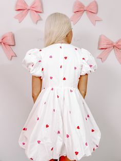 Turn heads and steal hearts in the Mark My Love dress from Sassy Shortcake. This playful white dress boasts puff sleeves and skirt. Red and pink embroidered hearts are placed throughout on both the front and back of this pretty. She features a v-neck and hidden back zipper. Lined. fits true to size, model wearing a size small also available in red. White Sweet Style Puff Sleeve Dress, Cute White V-neck Dress, White V-neck Cute Dress, Pink Heart Print Short Sleeve Dress, Pink Short Sleeve Dress With Heart Print, Cute White Dress With Puff Sleeves, Cute Short Sleeve Dresses With Heart Print, Cute Short Sleeve Dress With Heart Print, Heart Print Short Sleeve Dresses For Spring