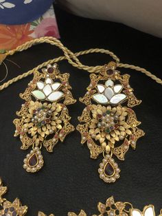 A luxurious spin on traditional jewelry design! Crafted to blend in every celebratory occasion! Meet the perfect festive set for the upcoming wedding season. Beautiful and hand crafted bridal set is embellished with multi stones and multicolored beads in gold polish. Set included: necklace, earrings, Make to order and shipping time 4-6 weeks. Hand crafted and gold plated kundan indian/pakistani jewelry Material:brass,stone,gemstone,pearl We bring you casual as well as party wear jewelry which co Kundan Mala, Wedding Jewelry Indian, Hyderabadi Jewelry, Braid Accessories, Jewelry Kundan, Jewelry Pakistani, Small Intimate Wedding, Pakistani Jewelry, Kundan Earrings