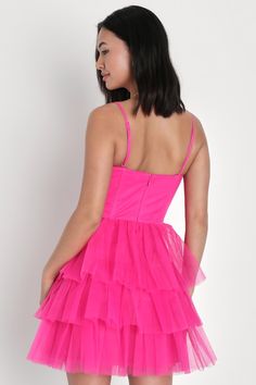 Treat any event like your own personal fashion show when you're wearing a show-stopping look like the Lulus Rule the Runway Hot Pink Tulle Bustier Tiered Mini Dress! This stunning dress is composed of sheer mesh tulle (atop a stretch knit lining) that shapes an alluring bustier-inspired bodice with seamed cups and supportive boning, a sweetheart neckline, and adjustable spaghetti straps. The high, fitted waist tops an A-line mini skirt, adorned with fluffy tiers of tulle that are sure to make you look ""tulle-y"" mesmerizing as you dance the night away! Hidden back zipper/clasp. Fit: This garment fits true to size. Length: Mid-thigh. Size medium measures 32.5" from top to bottom. Bust: Great for any cup size. Waist: Fitted - very fitted at natural waist. Hip: Not Fitted - room for hips. Un Tulle Tiered Dress, Hot Pink Mini Dress, Pink Stuff, Pink Homecoming Dress, Tiered Mini Dress, Lulu Fashion, Dress Tulle, Winter Formal, A Line Mini Skirt