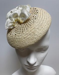 When you buy a Fascinator made from Toquilla Straw, you don't just buy a Fascinator, you buy a piece of art. This genuine Panama hat is woven in Ecuador by Ecuadorian Artisans. Colour & Dimensions: ---------------------- Classic Design: Lili Shape: Blocked using the Large wooden block Colour: Beige Crown: 20cm Height: 3.5 cm Silk flowers  high quality crystal pearls Elastic band inside  It is made from 100% toquilla straw, the same fiber used to make the very famous Panama Hat.   Be aware this h Handmade Fitted Vintage Fascinator, Adjustable Short Brim Fascinator For Beach, Adjustable Woven Hat With Structured Crown, Adjustable Sinamay Straw Hat For Royal Ascot, Elegant White Woven Straw Hat, Vintage Adjustable Fascinator With Structured Crown, Adjustable Structured Crown Straw Hat For Kentucky Derby, Adjustable Straw Hat With Structured Crown For Kentucky Derby, Summer Adjustable Headpiece With Handmade Flowers