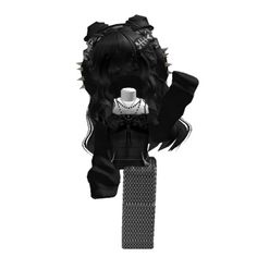 a black and white photo of a doll with spikes on it's head, sitting on top of a pole