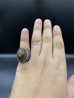 Unique Afghani Handmade Silver Ring Engraved Flower On Sides Of The Ring, Size 8 US Spiritual Carved Round Ring, Vintage Brown Flower-shaped Jewelry, Artisan Etched Ring Jewelry, Engraved Brown Ring Perfect For Gift, Handmade Brown Ring For Wedding, Antique Adjustable Etched Ring, Antique Adjustable Etched Rings, Adjustable Oval Rings In Brown, Adjustable Oval Brown Rings