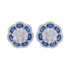 18 Karat White Gold Blue Sapphire and Diamond Contemporary Cluster Stud Earring These convoluted cornflower blue sapphire ovals with the mix shape and cut of diamonds all layered together extraordinarily define the earring stud. The first layer is an artistic brilliant round 7-diamond clean flower warming the eyes, as the rest of the layers follow. The second layer is of gracefully angled rose cut pear diamonds that bring the sumptuous element before the layer of blue sapphires. The identically Blue Sapphire Oval Diamond Earrings, Blue Cluster Earrings In Fine Jewelry Style, Fine Jewelry Blue Cluster Earrings, Blue Cluster Earrings Fine Jewelry, Blue Diamond Earrings With Diamond Cut, Blue Diamond Cut Earrings, Blue Cluster Earrings For Anniversary, Blue Multi-stone Cubic Zirconia Earrings, Blue Diamond Cut Earrings Fine Jewelry