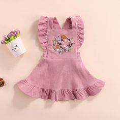 Dress your little princess in the cutest style with our Flower Embroidered A-line Princess Dress! This vintage inspired dress features suspender ruffles and delicate flower embroidery, perfect for any occasion. Made from soft and comfortable fabric, your little one will look and feel like a true princess! Cute A-line Cotton Sundress, Cute Cotton A-line Sundress, Spring Cotton Dress With Floral Applique, Princess Style Sleeveless Dresses With Floral Embroidery, Summer Princess Style Embroidered Dress, Princess Style Embroidered Summer Dress, Embroidered Princess Style Summer Dresses, Playful Floral Embroidery Dress For Spring, Cotton Sleeveless Ruffled Suspender Dress