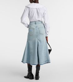 High-rise denim midi skirt in blue - Ganni | Mytheresa Workwear Cotton Denim Skirt In Medium Wash, Medium Wash Cotton Denim Skirt For Work, Workwear Denim Skirt In Medium Wash, Cotton Denim Skirt In Medium Wash For Work, Trendy Spring Denim Midi Skirt, Chic Cotton Denim Skirt For Spring, Trendy Midi Denim Skirt For Spring, Trendy Midi-length Denim Skirt For Spring, Chic Skirt With Frayed Hem For Spring