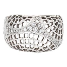 Stylish vintage Cariter ''Nouvelle Vague'' diamond ring crafted in 18 karat white gold (circa 2000).   Round brilliant cut diamonds total an estimated 0.35 carats (estimated at F-G colour and VVS2 clarity).    The out of production Cartier highlights an openwork lattice design with a low dome, sprinkled with diamonds. The ring rises 5mm from the finger (0.19 inches). The ring is great worn alone or stacked with your fine jewellery from any era.   The ring is in very good condition. We have not c Paris Ring, King Edward Vii, King Edward, Lattice Design, Dome Ring, Ring Crafts, Domed Ring, Ring Diamond, Round Brilliant Cut Diamond