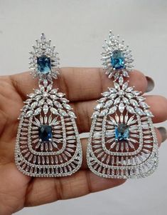 You will get same design as you seen in the picture. these are American diamond jewellery made with Cubic Zirconia stone that give you an elegant shine . Every care is taken for packing so that the item reaches the buyer safely and undamaged. Instructions: Keep Jewellery away from direct heat, perfumes and other strong chemicals as they may react with the metal or plating. The plating composition of Jewellery is as such that sweat will not damage it. Wiping the jewellery with a soft cloth after Dazzling Crystal Chandelier Earrings For Gift, Dazzling Cubic Zirconia Chandelier Earrings As Gift, Party Jewelry Sets With Matching Drop Earrings, Diamond White Jewelry Sets With Matching Earrings For Party, Elegant Crystal Earrings Cubic Zirconia For Gift, Diamond White Chandelier Earrings As Gift, Elegant Diamond White Chandelier Earrings For Gifts, Elegant Diamond White Chandelier Earrings As Gift, Dazzling Chandelier Earrings With Sparkling Stones As A Gift