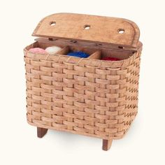 a wicker basket with two compartments filled with soaps