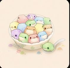 a bowl filled with lots of different colored animals next to a spoon and cup full of food