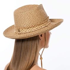 Tucson is a designer woman's sunhat for sale made of Squishee®. The modified Western shape has a fringe edged band and a self bolo braid chin strap with a wood bead to adjust and secure it. The signature logo rivet is discretely placed at the back of the crown. The wired brim permits shaping; push up the sides for more Western flare, or flatten them out for additional shade. Squishee® is a man-made material incorporating recycled fibers. It looks and feels just like natural raffia but has the ad Elegant Adjustable Braided Hat, Elegant Adjustable Woven Hat Bands, Adjustable Woven Fedora For Spring, Trendy Adjustable Hat Bands For Kentucky Derby, Adjustable Braided Hat Bands For Spring, Adjustable Braided Fedora Hat, Adjustable Woven Fedora With Short Brim, Braided Flat Brim Fedora, Adjustable Fedora With Braided Detail And Flat Brim