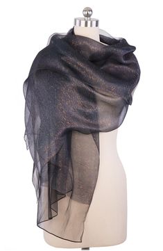 A sheer, shimmering scarf that will quickly become your go-to piece for going out. Bonus: it looks gorgeous as both a wrap and a scarf. 28" x 75" (one size) Pattern: Solid 100% silk Hand wash Imported Black Sparkly Scarf, Celestial Shawl, Faye Wong, Hunter Schafer, Taylor Russell, Summer Shawl, Nana Komatsu, Classic Scarf, Shailene Woodley