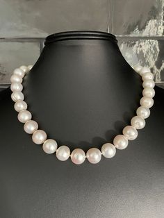 Freshwater Single Strand Bridal Pearl Necklace. This beautiful necklace is the epitome of class. One unique strand of hand strung and individually knotted pearls. The luster is very good. All of the pearls are beautifully matched for luster, color and overtone. 18 inch, with a sterling silver toggle clasp. Quality pearl necklaces are always knotted between the pearls. The necklace is double hand-knotted with silk thread. This protects the pearls from rubbing together and becoming damaged. All pe Cheap Vintage Single Strand Pearl Necklace, Classic Round Hand-strung Jewelry, Pearl White Single Strand Pearl Necklace, Elegant Adjustable Hand-strung Pearl Necklace, Single Strand Round Pearl Necklace Gift, Single Strand Pearl Necklace Gift, Single Strand Round Pearl Necklace As Gift, Adjustable Round Pearl Necklace For Formal Occasions, Adjustable Pearl Necklace For Formal Occasions