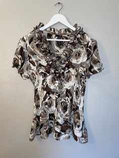 "Floral top womens shirt blouse Condition: Good Measurements  bust 40\"  length 25\"" Elegant Patterned Cotton Tops, Elegant V-neck Shirt With Floral Print, Elegant Floral Print V-neck Top, Elegant V-neck Floral Print Shirt, Elegant V-neck Floral Print Tops, Fall Printed Short Sleeve Blouse, Fall Season Printed Short Sleeve Blouse, Short Sleeve Patterned Blouse For Spring, Patterned Short Sleeve Blouse For Spring