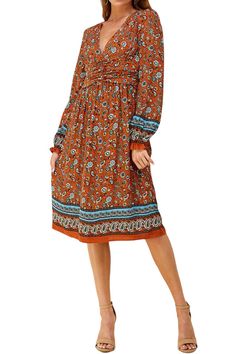 The Bohemian Printed Midi Dress from Iconic Luxe combines artistic flair, comfort, and practicality. Its unique design elements and Bohemian-inspired prints make it a standout choice for expressing your individual style. This dress is versatile and can be dressed up or down. It's suitable for casual outings, daytime events, or even dressed up for special occasions, depending on your styling choices. To complete your look, consider adding accessories such as delicate necklaces, oversized sunglasses, a wide-brimmed hat, and comfortable sandals . You can also experiment with a fringed bag and ankle boots. 100% Rayon Imported Zipper closure Hand Wash Only Features: deep V-neckline, long sleeves with elastic and ruffles details, front shirring, midi length, back zipper, paisley print Suit for: Multicolor Printed Midi Dress For Fall, Fall Season Multicolor Printed Midi Dress, Bohemian Paisley Print Midi Dress For Fall, Brown Printed Flowy Dress, Casual Boho Print Patterned Midi Dress, Spring Bohemian Midi Dress With Abstract Print, Hippie Brown Floral Print Dress, Bohemian Midi Dress With Abstract Print For Spring, Hippie Patterned Printed Dress