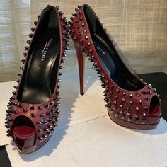 Philipp Plein Burgundy Leather Open-Toe Platform Pumps. Burgundy Patent Leather Heels & Platforms. Has Silver Metal Decor All Over The Pumps. Size 37.5 - 7.5. 9.5" Long From Tip To Tip Following Slope Taken Inside Shoes. 5" Heel Height. 1.25" Toe Platform Height Or Thickness. Made In Italy. Very Sexy. A Show Stopper. Philipp Plein Shoes, Platform Pumps Heels, Inside Shoes, Patent Leather Heels, Platform Pumps, Patent Leather, Open Toe, Shoes Women Heels, Heel Height