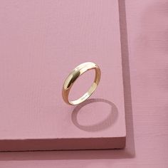 The Minimalist Dome Ring has an elegant design that its plainness is the modesty which will fascinate people around you. It is perfect for everyday use and ring stacking. - Made in 14k Solid Gold - Top Width: 4.10 mm / 0.16 inches - Thickness: 0.86 mm / 0.03 inches- Bottom Width: 2.53 mm / 0.09 inches - This product comes with iconic Norm Jewels gift box Minimalist Dome Ring With Thick Band For Wedding, Formal Stackable Midi Rings With Round Band, Minimalist Thick Band Wedding Rings, Minimalist Dome Ring For Wedding With Open Band, Minimalist Open Band Dome Ring For Wedding, Minimalist Wedding Rings With Smooth Bezel, Timeless Open Midi Rings With Simple Design, Minimalist Dome Ring With Thick Band For Promise, Minimalist Thick Band Dome Ring For Promise