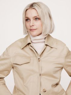 An ode to 90s minimalism, we pared back the utilitarian detailing for this short jacket, opting for a concealed button placket and welt pockets at the front.  We cut this one in a beautiful stretch-cotton sateen fabric, one we love for its dressed-up appearance.  Warm: Unlined.  Relaxed fit.  Point collar with concealed button front.  Side seam and single chest pockets.  Unlined.  Relaxed fit.  Long sleeves.  Hip length.  Model: Size S, 5'10" (178cm). Chic Collared Utility Jacket With Flap Pockets, Chic Button-up Utility Jacket With Flap Pockets, Spring Cropped Jacket With Patch Pockets For Work, Modern Collared Outerwear With Patch Pockets, Workwear Cropped Button-up Jacket With Patch Pockets, Utility Style Cropped Jacket With Flap Pockets, Modern Utility Jacket With Pockets For Work, Utility Cropped Jacket With Flap Pockets, Button-up Cropped Jacket With Patch Pockets For Work