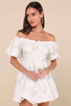 Get ready to be the sweetest babe at the party in the Lulus Adorable Crush Ivory Jacquard Off-the-Shoulder Mini Dress! Lightweight woven jacquard, with a floral design throughout, shapes this darling dress. Short puff sleeves (with elastic at the cuffs and decorative bows at the shoulder) frame an off-the-shoulder neckline with ruffle trim and an adjustable, elasticized drawstring that forms a playful matching bow at the center. Gathered bust tops a high, banded waist. Skirt has a flirty bubble Cream Off-shoulder Party Dress, Feminine White Off Shoulder Dress For Party, Cream Puff Sleeve Mini Dress For Party, Cream Off-shoulder Mini Dress, White Off Shoulder Dress With Short Sleeves For Party, White Off Shoulder Short Sleeve Party Dress, Off-shoulder Cream Mini Dress For Brunch, Cream Off-shoulder Mini Dress For Brunch, Cream Off-shoulder Dress For Brunch