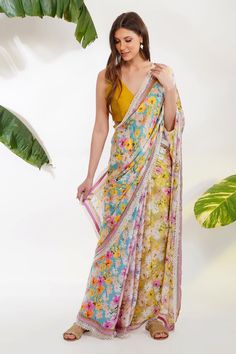 Multi color saree in with floral print and cutdana and pearl borders. Comes with an unstitched yellow blouse fabric.
Component: 2
Pattern: Printed
Type Of Work: Tropical Floral
Fabric: Viscose Satin Georgette; Blouse: Chanderi
Color: Multi Color
Other Details: 
Scalloped pearl border
Note: The blouse worn by the model is not for sale
Occasion: Mehendi and Haldi - Aza Fashions Summer Saree, Pearl Border, Blouse Stitching, Pearl Work, Saree For Women, Print Saree, Georgette Blouse, Printed Saree, Yellow Blouse