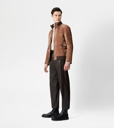 Synthesis of urban style and craftsmanship, this bomber jacket is crafted in soft suede, with ribbed knit collar and bottom hem. Fastened with branded buttons, it comes with two wide pockets with flap and two internal zipped pockets. Luxury Brown Outerwear With Concealed Placket, Suede Outerwear With Concealed Placket For Work, Classic Suede Outerwear With Concealed Placket, Luxury Suede Leather Jacket For Fall, Luxury Long Sleeve Suede Outerwear, Suede Outerwear With Welt Pockets For Fall, Business Suede Outerwear With Pockets, Fall Suede Outerwear With Welt Pockets, Winter Business Outerwear With Ribbed Cuffs