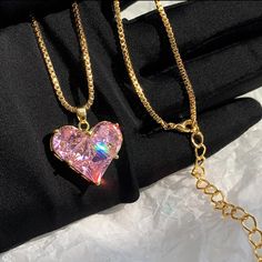 This Stunning Pink Sapphire Heart Pendant Necklace Is The Perfect Blend Of Elegance And Charm. The Heart-Shaped Crystal Sparkles With Rainbow Reflections, Beautifully Set In A Gold-Plated Chain For A Luxurious Look. The Adjustable Chain Allows For A Customized Fit, Making It A Versatile Piece For Any Occasion, Whether Casual Or Formal. Condition: Brand New, Never Worn. Details: - Gold-Plated Chain - Pink Lab Sapphire Heart Pendant - Adjustable Chain For A Perfect Fit - Eye-Catching And Glamorous Heart Cut Charm Jewelry For Party, Heart Cut Jewelry With Heart Charm For Party, Party Jewelry With Heart Cut Charm, Heart Pendant Jewelry For Mother's Day Party, Pink Gold Plated Necklace For Anniversary, Valentine's Day Rose Gold Heart Necklace, Pink Double Heart Jewelry Gift For Her, Gold Heart Beads Necklace For Party, Heart Beads Heart-cut Necklace For Party