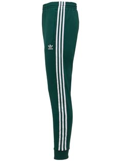 Green Sportswear Bottoms With Three Stripes, Green Pants With Side Stripes For Streetwear, Green Side Stripe Pants For Streetwear, Green Streetwear Pants With Side Stripes, Adidas Green Bottoms For Streetwear, Green Sweatpants With Side Stripes For Streetwear, Green Adidas Sporty Pants, Adidas Green Sporty Pants, Bottoms Men