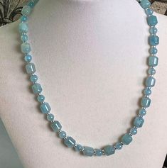 "Aquamarine Beaded Necklace for women,  Natural Birthstone Necklace March, Blue Crystal Necklace This lovely necklace features 6mm round and 10mm x 8mm tube shaped aquamarine beads, separated by small sterling silver discs.  Luscious.  The necklace shown here measures about 18\" but you can choose your preferred length at checkout.  Wear it to work, or with that little black dress, or with your favorite little tee shirt!  It's such a pretty blue you'll want to wear it with everything.    Make a Blue Crystal Necklace, Furniture Flip, Aquamarine Necklace, Aquamarine Beads, Gemstone Beaded Necklace, Lovely Necklace, Blue Necklace, Birthstone Necklace, Blue Crystals