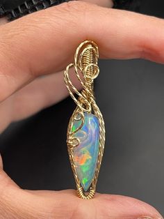 This beautiful Ethiopian Opal gold filled pendant is about 1 1/4 inches tall and 1/2" wide, it includes a 18" gold filled necklace and in a gift box, ready for gifting! These are not costume pieces that will chip away or rust over time. They will last forever if taken care of, which is why I include a free polishing cloth with every order.  All of my pieces are made with high quality wire from Rio Grande. Quality is very important to me! Message me, If you have any questions, I'm happy to help. Wire Wrapped Yellow Gold Pendant Jewelry, Yellow Gold Wire Wrapped Pendant Jewelry, Handmade Gold Jewelry For Birthday Gift, Artisan Teardrop Jewelry For Gifts, Gemstone Pendant Jewelry For Birthday, Wire Wrapped Pendant Jewelry Gift, Wire Wrapped Pendant Jewelry For Gifts, Elegant Opal Jewelry With Large Pendant, Hand Wrapped Yellow Gold Jewelry As Gift