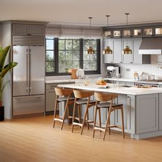 a kitchen with wooden floors and gray cabinets