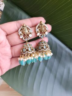 Fine Victorian Kundan Jhumka with CZ stones and uncut Polki Kundan stones Surely a statement Jhumka earringThe earring has very fine quality and craftmanship and also has a very elegant look pictures cannot do justice to how beautiful this jhumka earrings is . Length 2.5 inches Fusion Kundan Jhumkas Drop Earrings, Kundan Fusion Dangle Jhumkas, Fusion Style Kundan Dangle Jhumkas, Kundan Fusion Jhumkas, Fusion Style Kundan Jhumkas, Temple Jewelry Jhumkas For Reception, Blue Stone Work Temple Jewelry Earrings, Stone Work Drop Jhumkas For Reception, Stone Work Jhumkas For Reception