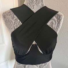 Nwot. Never Worn. Sexy Underwire With Front Crossover Fabric. 95% Polyester, 5% Spandex. Stretch Crisscross Halter Top With Built-in Bra, Chic Black Low-cut Crop Top, Black Low-cut Crop Top With Built-in Bra, Chic Seamless Halter Top For Party, Elegant Black Halter Top With Crisscross Straps, Black Crop Top With Built-in Bra For Night Out, Chic Black Swimwear With Straps, Black Fitted Underwire Crop Top, Bandeau Bandage Crop Top For Party