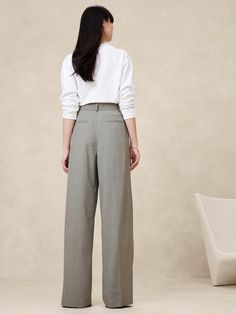 Sophisticated and decadent, this exceptionally tailored pant is crafted from our best-selling Italian stretch-wool with elegant double pleating at the front to enhance its wide-leg silhouette.  Relaxed Wide-Leg Fit: Super high waisted.  Relaxed fit from hip to thigh, voluminous leg.  Full length.  Fabric from Italy's Marzotto mill.  Internal button-tabs at the waistband adjust from high-rise to ultra-high rise.  Zip fly with hook-and-bar closure.  Belt loops.  Front and back pockets.  Unlined. Fall Capsule Wardrobe, Wool Pants, Petite Size, Siena, Trousers Women, Capsule Wardrobe, Large Size, Banana Republic, Full Length