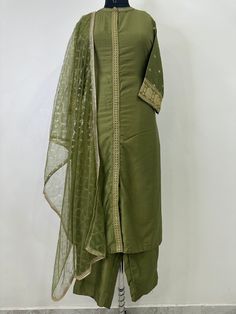 Indian Wedding Wear Salwar Kameez / Indian Ethnic Dress / Plus Size Silk Kurta Dress Traditional Indian Wear / Salwar Kameez Dupatta / Kurti Palazzo Set / Party Wear/ Silk Kurta Set ITEMS DETAILS:- Olive Green Sequinned design Kurta with Trouser and Dupatta Kurta design: * Sequinned Work  * Straight shape * Regular style * Band Neck  * Three-quarter regular sleeves * Calf length with straight hem * Silk blend woven fabric Palazzos design:  * Solid Trousers 1 Pocket  * Partially elasticated waistband * Slip-on closure Dupatta length: 2 metres (approx.)  Top fabric: Silk Blend Bottom fabric: Silk Blend Dupatta fabric: Net Hand Wash NOTE:- please see the size chart in the image to choose a perfect size. Please feel free to ask any question regarding this item. WE ALSO ACCEPT CUSTOMISATION AS Traditional Green Palazzo Set With Dabka, Traditional Green Palazzo Set With Dabka Details, Festive Green Salwar Kameez With Cutdana, Pista Green Cotton Silk Palazzo Set With Straight Kurta, Anarkali Art Silk Salwar Kameez With Dabka, Transitional Pista Green Palazzo Set With Dabka Work, Cotton Silk Churidar For Wedding And Diwali, Silk Kurta With Dupatta In Pista Green, Pista Green Cotton Silk Kurta With Dupatta