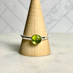 Handmade Sterling Silver Rose Cut Peridot Stacking Ring Peridot is considered to be a warm, friendly and joyful stone, and is the gemstone to give for your 16th wedding anniversary...who knew?  This sterling silver peridot stacking ring is also a perfect gift for someone with an August birthday.  Here are the details:  * This sturdy ring has a 6mm bezel set faceted or smooth peridot cabochon set on a sturdy sterling silver band. This item is handmade to order by Barb Macy in Corvallis, OR.  Gemstone Stacking Rings: https://accentyourself.etsy.com?section_id=34469918 Plain Silver Rings: https://accentyourself.etsy.com?section_id=34485443 Our Etsy Shop:  https://accentyourself.etsy.com * This stacking ring is made to order, so please allow about a week for completion.  Your ring will be pack Lime Green Birthstone Ring As Gift, Adjustable Green Round Birthstone Ring, Green Stackable Rings For Gift, Lime Green Gemstone Birthstone Ring As Gift, Lime Green Birthstone Ring As A Gift, Lime Green Gemstone Birthstone Ring For Gift, Adjustable Stackable Rings For Wedding, May Birthstone, Peridot Stackable Birthstone Ring As A Gift, Lime Green Round Ring As A Gift