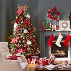 a living room decorated for christmas with stockings