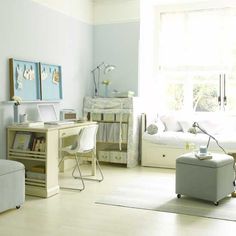 a living room filled with lots of furniture and white walls in the background is a large window