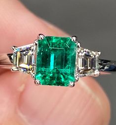 ALL THESE PHOTOS WERE TAKEN WITH AN ORDINARY IPHONE & HAVE NOT BEEN EDITED OR ENHANCED IN ANY WAY. VIDEO LINKS: https://youtube.com/shorts/91DOEQGWjzk?feature=share https://youtube.com/shorts/z3jiQSNa_IY?feature=share Up For Sale is Super Fine Natural Colombian Emerald & Diamond Ring in Solid 18K White Gold. This Ring was made by us Here in New York City & is of the Highest Quality. The Center Stone is a Fantastic Natural 1 Ct Vivid Green Emerald that measures Approx 6.4 x 5.1 mm, was Mined in C Luxury Multi-stone Exquisite Emerald Ring, Luxury Silver Emerald Ring With Tension Setting, Luxury Green Diamond Gemstone Ring, Luxury Tsavorite Emerald Cut Diamond Ring, Luxury Green Diamond Ring With Polished Finish, Luxury Emerald Ring With Vvs Clarity, Luxury Multi-stone Emerald Ring Timeless Style, Luxury Sterling Silver Emerald Ring With Brilliant Cut, Luxury Unique Emerald Ring With Gemstone Accents