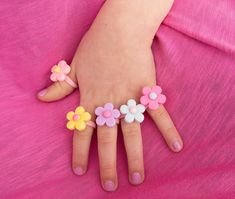 Pastel Flower Ring perfect for toddler and little girls. These little rings are a fun, affordable gift for kids, and add a pop of fun to any spring outfit.  This is for toddler and little kids, and too small for adults. It is not recommended for children under 3 years old, as it can pose as a choking hazard. The ring measures 14mm in diameter, or a size 3. Ideal for children age 3-6. MATERIALS USED -Approximately 18mm resin flower in pink, yellow, blue, purple, or light pink. -Pink plastic ring base Hot Pink Jewelry, Silver Baby Bracelet, Ring Kids, Toddler Jewelry, Newborn Baby Girl Gifts, Toddler Bracelet, Birthday Presents For Her, Kids Easter Basket