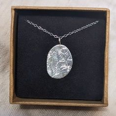 Sterling Silver Hand Engraved Peak District Necklace The sterling silver pendant is around 1.5cm tall and 1cm wide. It has been carefully engraved by hand to represent a scene inspired by the beautiful Peak District, in the UK 🏞️ The pendant is accompanied by an 18" chain. Please do message me if you would like a different length chain, I will happily accommodate where possible. Every purchase comes boxed and gift wrapped at no extra charge. - All metal used is 100% recycled - Handmade in Sheff Etched Sterling Silver Pendant Necklace, Etched Sterling Silver Necklace Gift, Sterling Silver Etched Necklace For Gift, Etched Sterling Silver Necklace For Gift, Artistic Engraved Sterling Silver Necklaces, Artistic Engraved Sterling Silver Necklace, Stamped Oval Pendant Jewelry Gift, Oval Pendant Jewelry For Gifts, Silver Etched Nature-inspired Necklaces