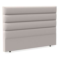 an upholstered headboard with four sections